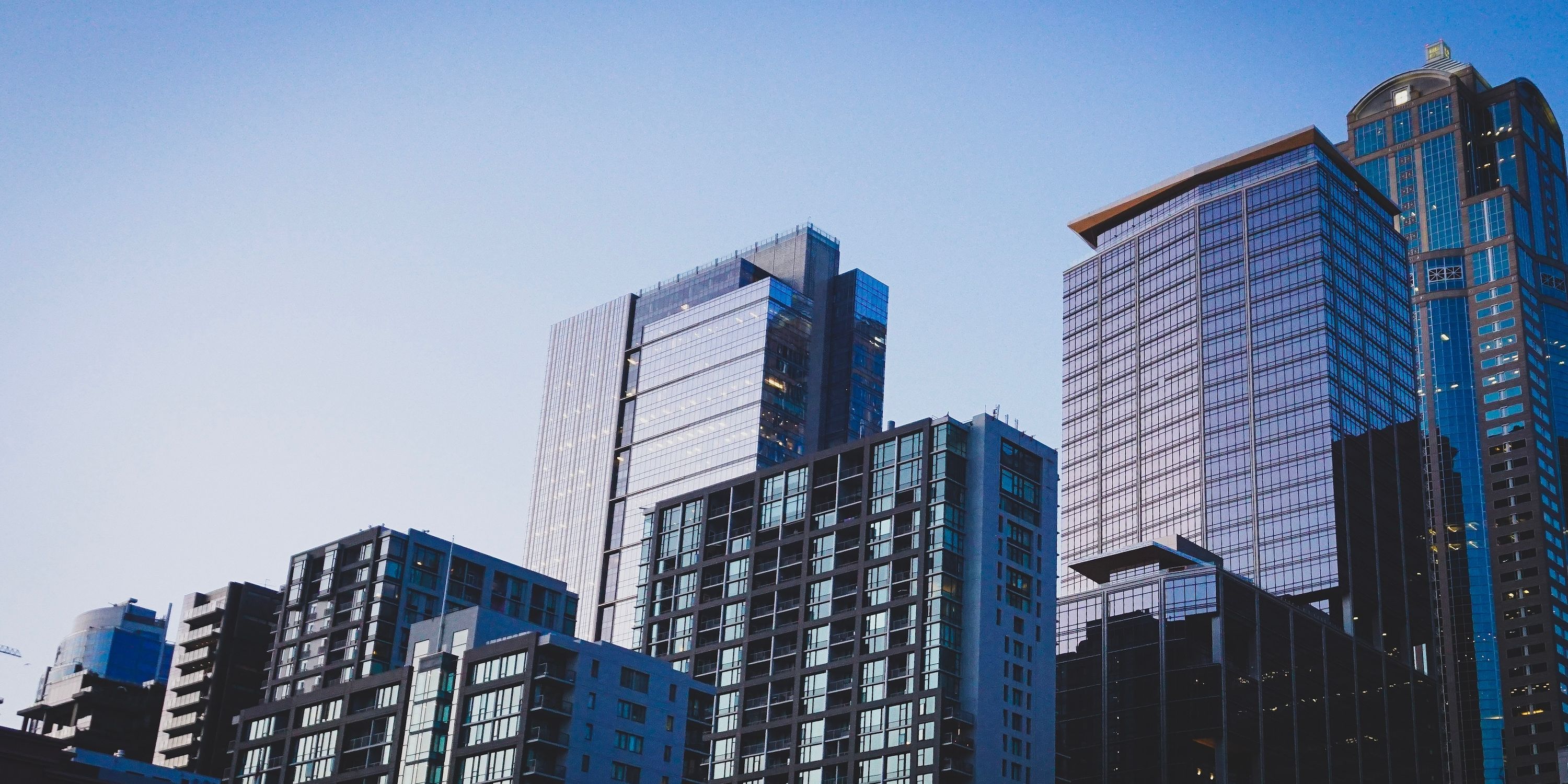 Downtown buildings under a blue sky.