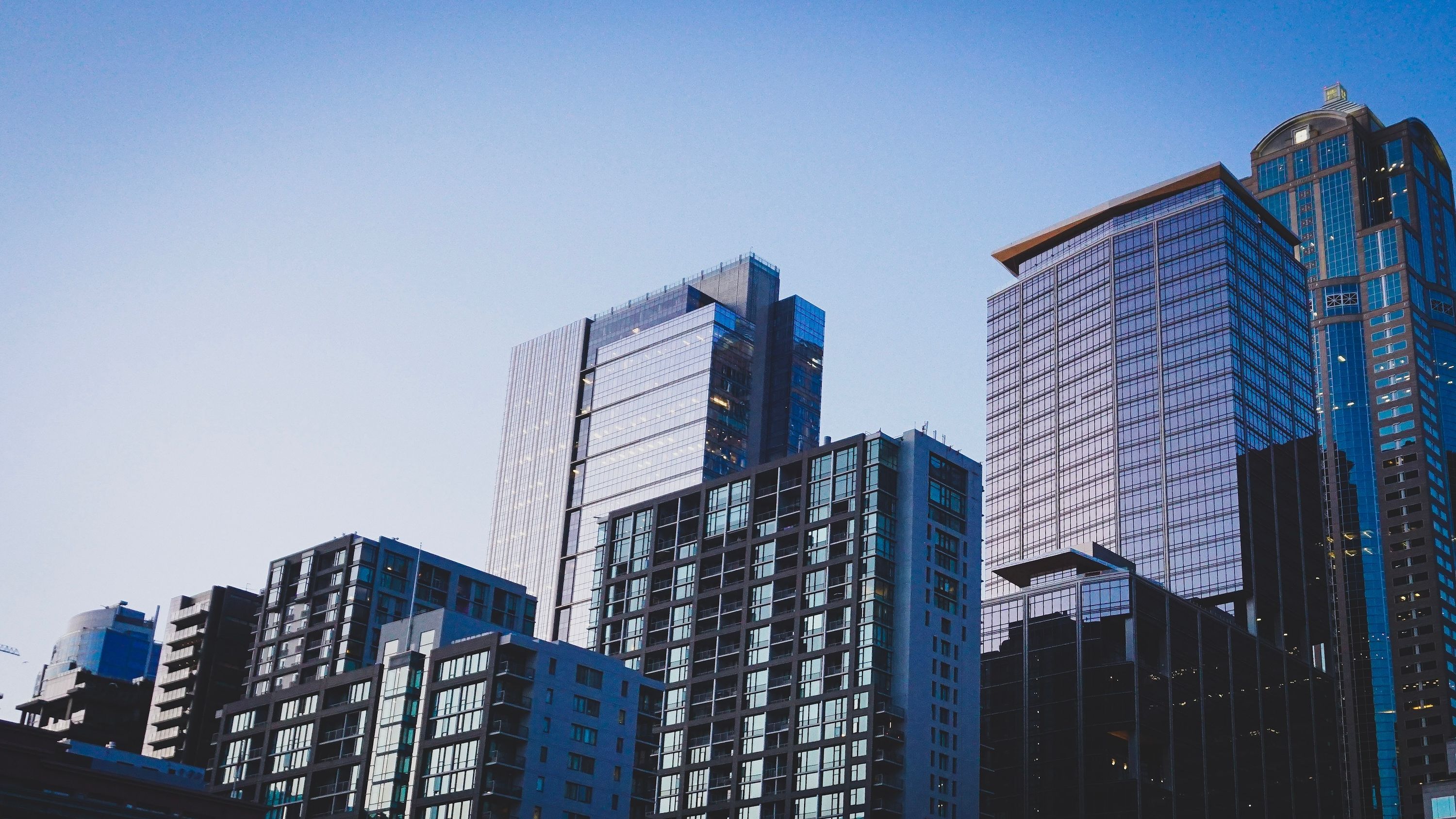 Downtown buildings under a blue sky.
