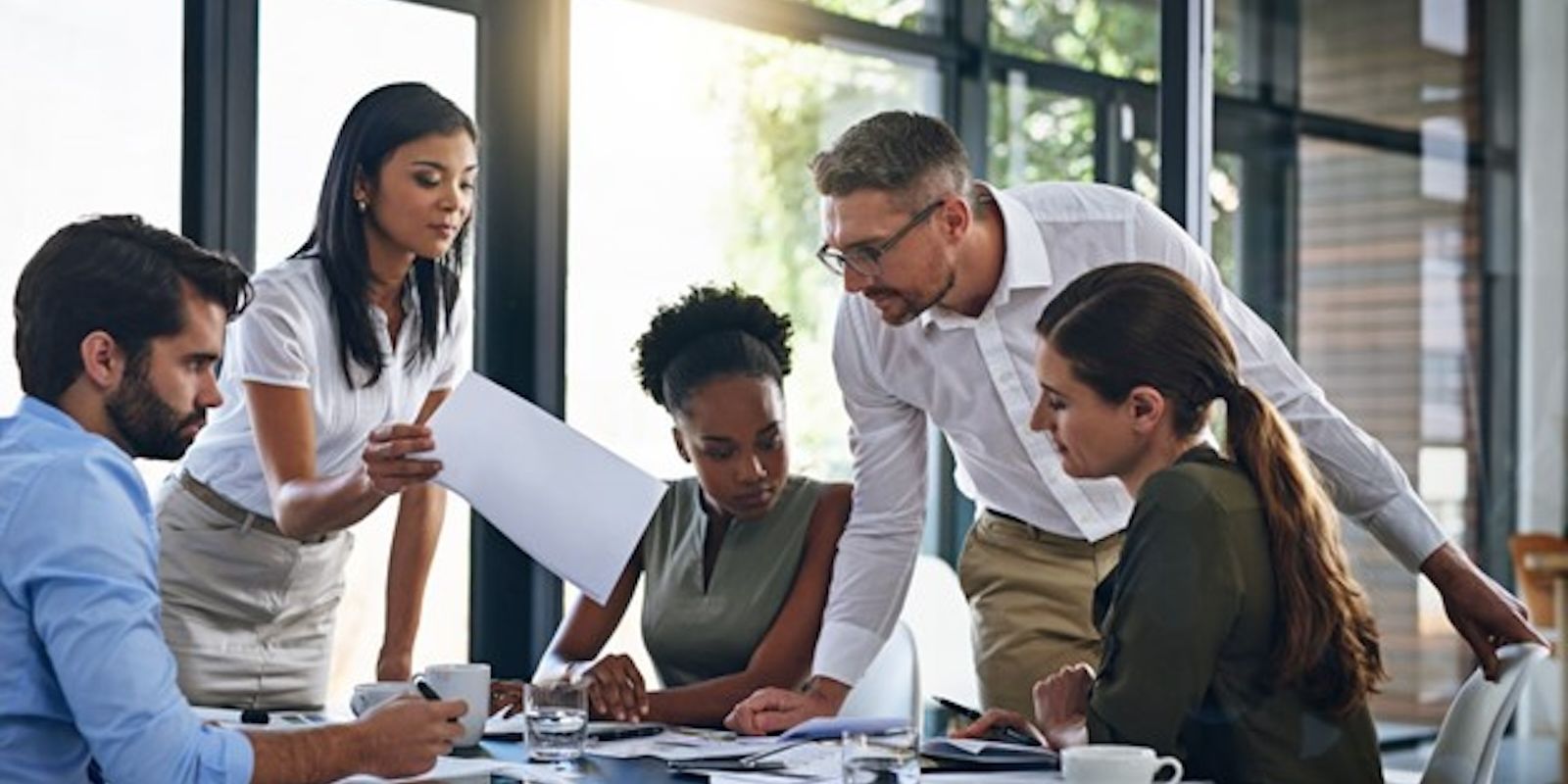 A team of young people go through the results of a survey.