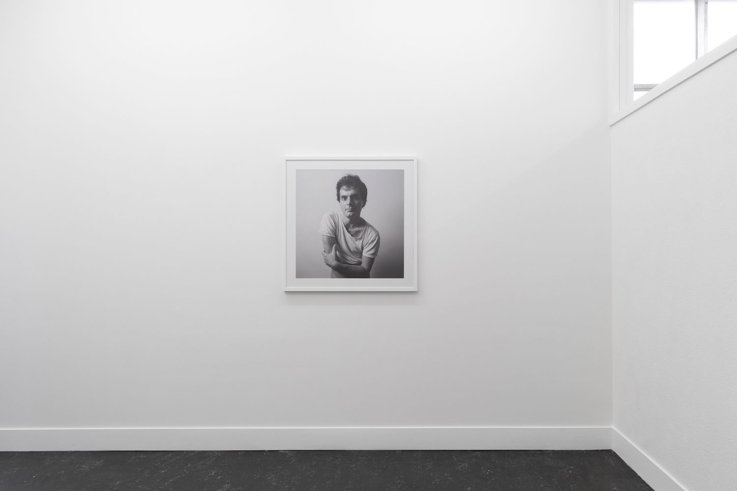 installation image of Adrienne Martyn, Total Control at Envy6011, Wellington, New Zealand. Black and white portraits of men from 1979 - 1988, cheska brown photography