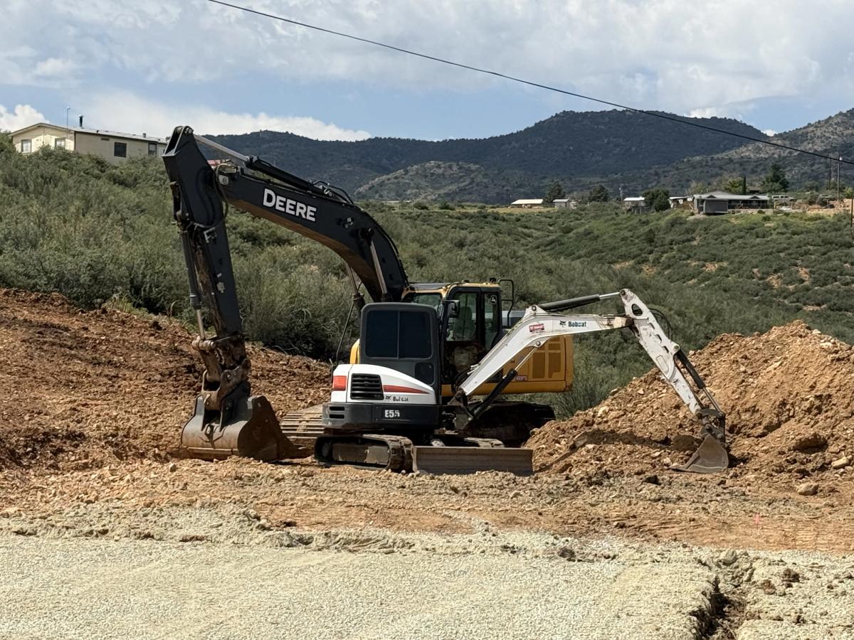 Excavators carrying out excavation and site preparation