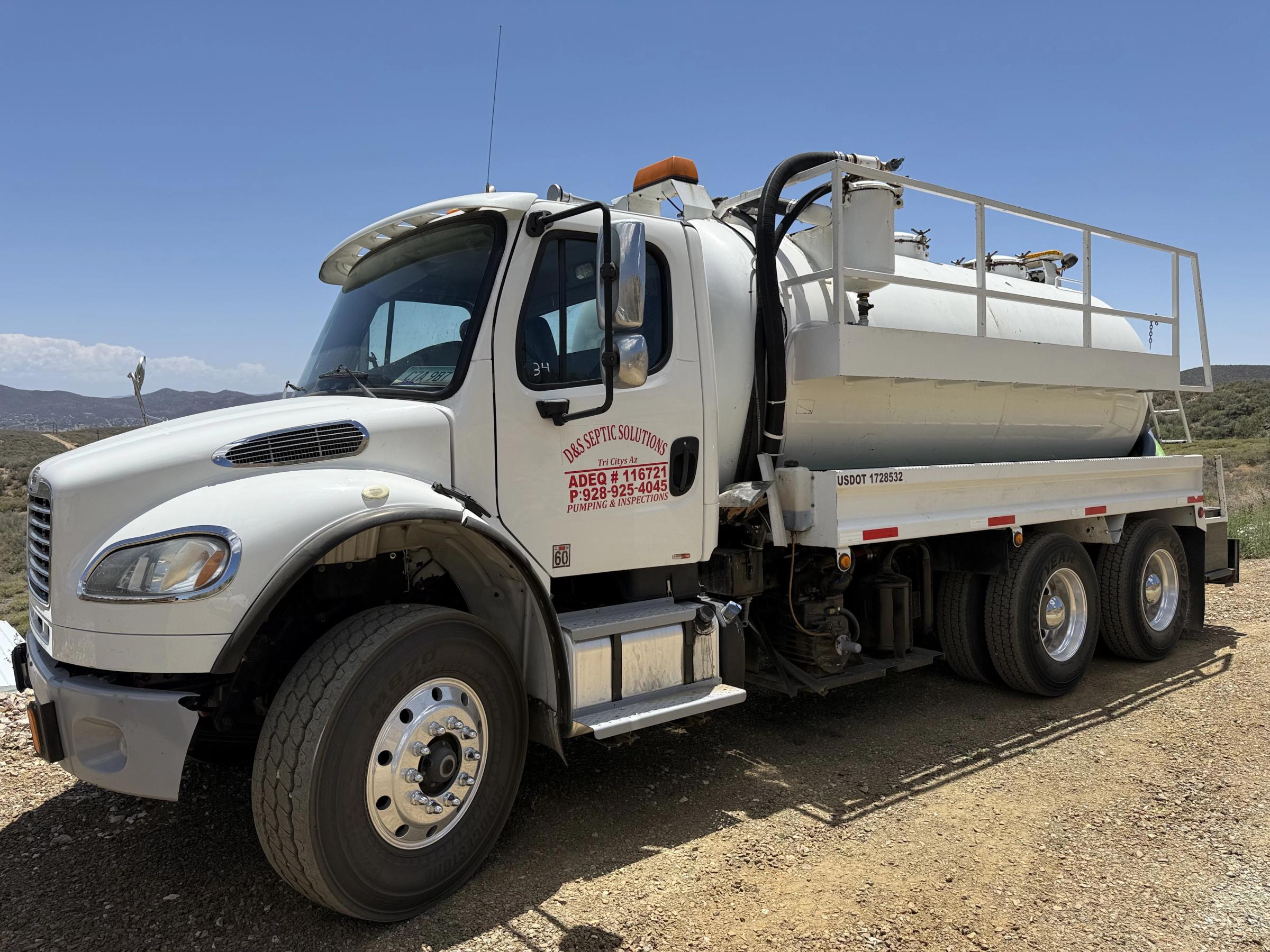 D&S Septic Solutions branded pumping truck at a job site