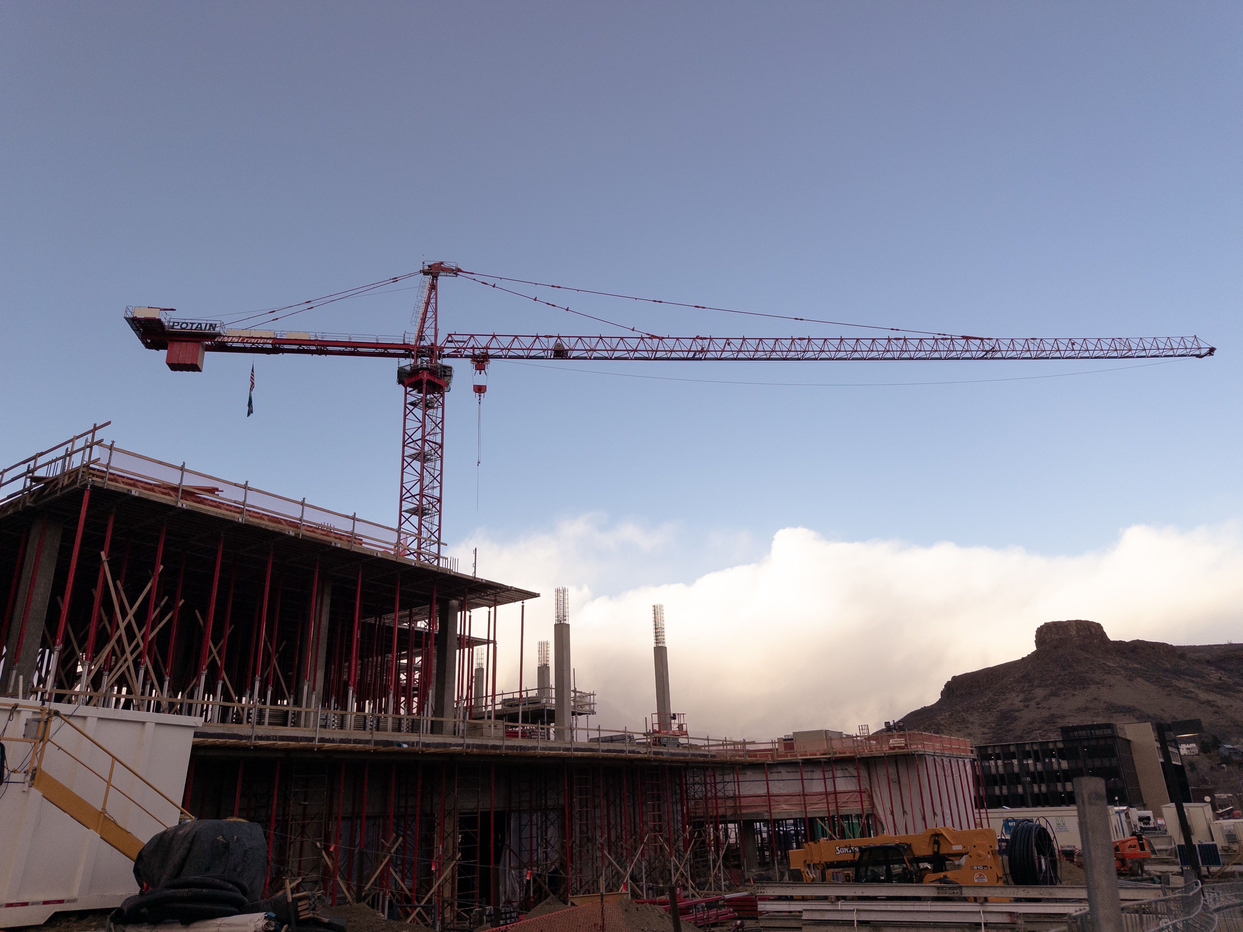 A red tower construction crane