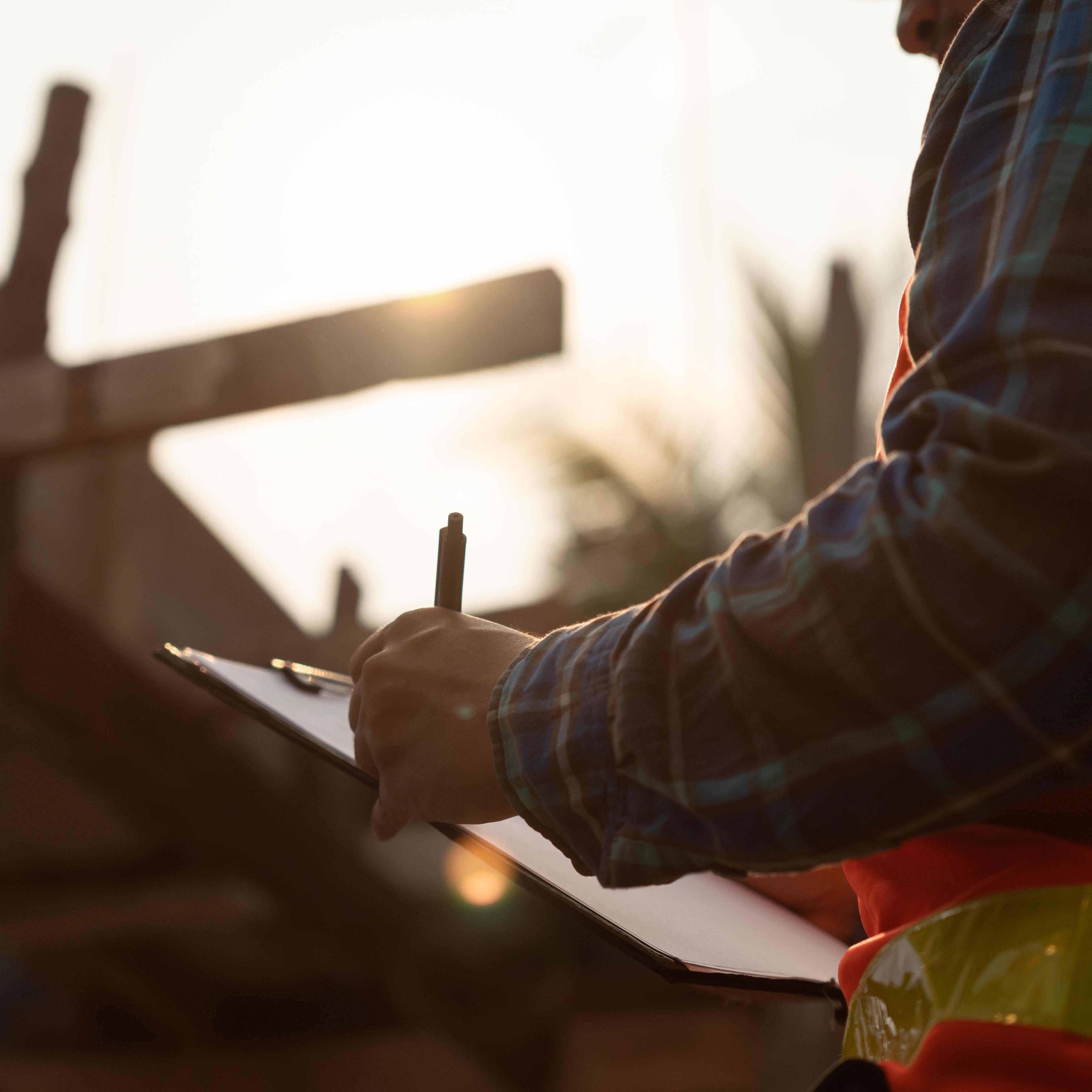 Man holding a check list