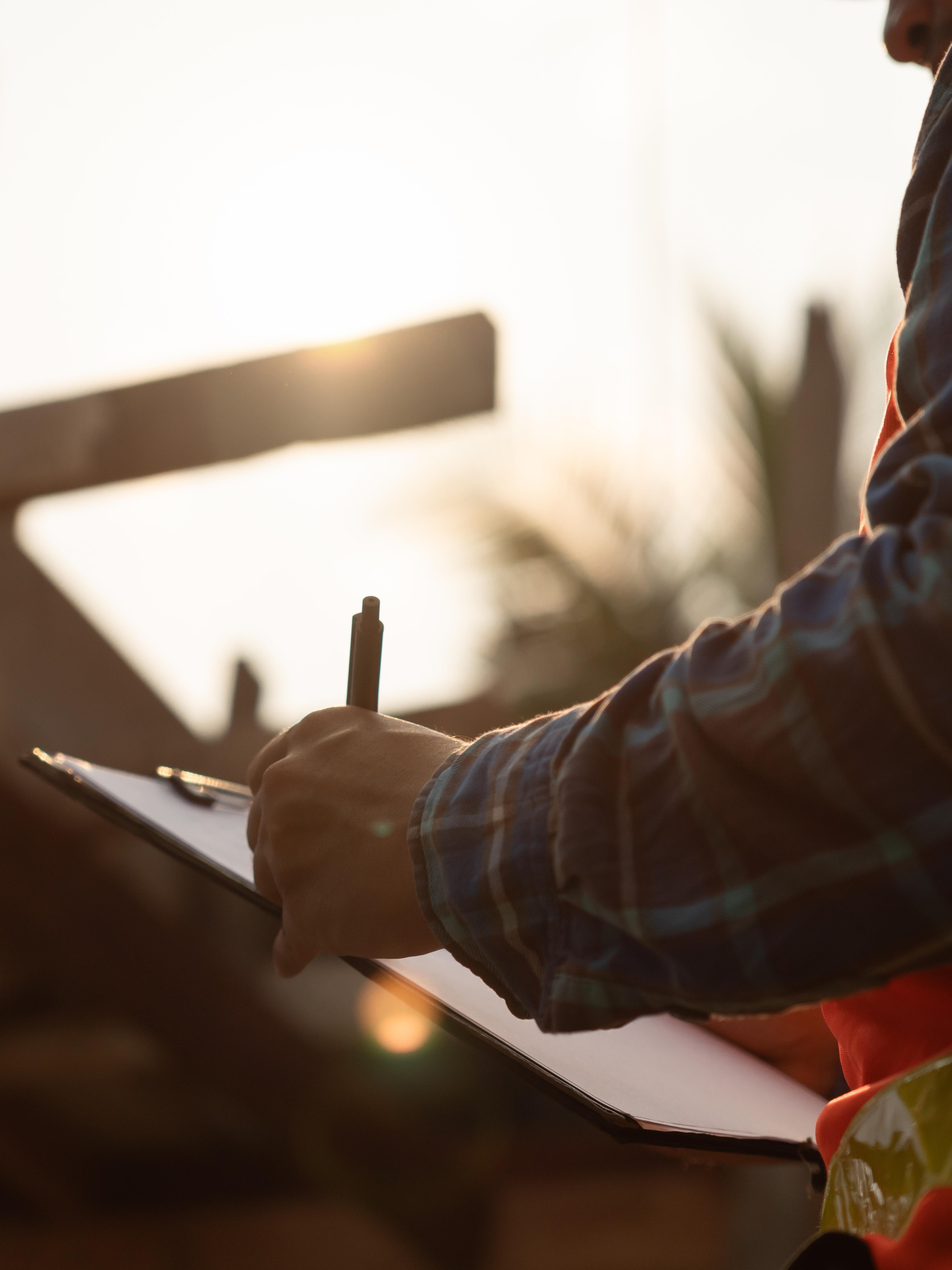 Man holding a check list