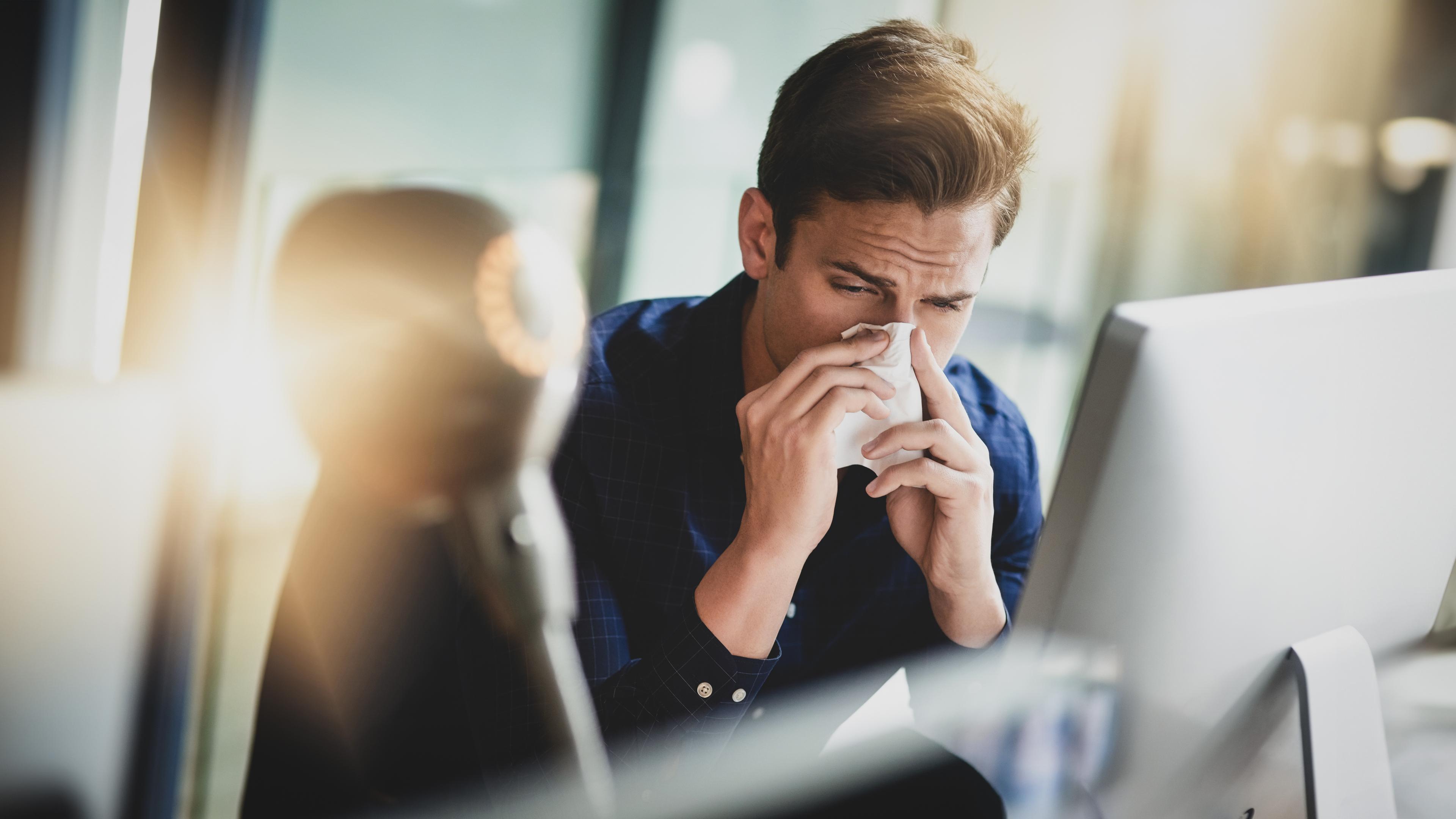 Man blowing his nose