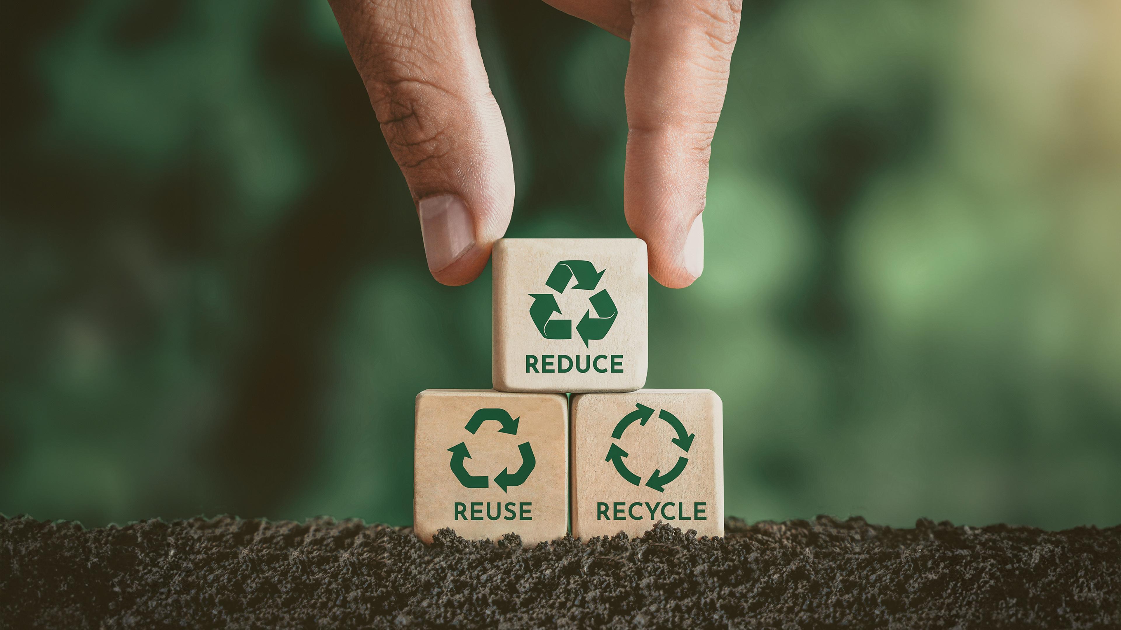 Wooden cubes with recycle signs