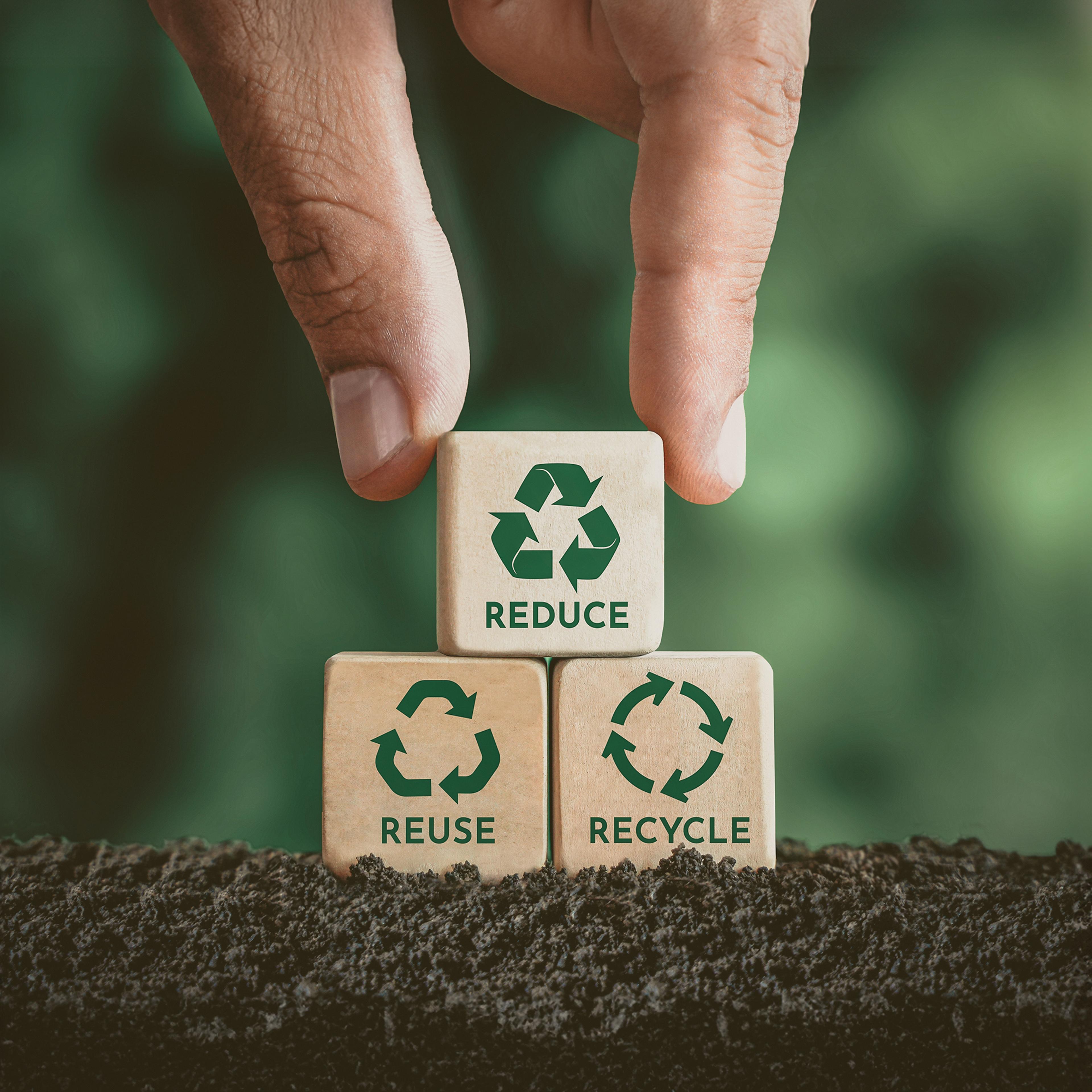 Wooden cubes with recycle signs
