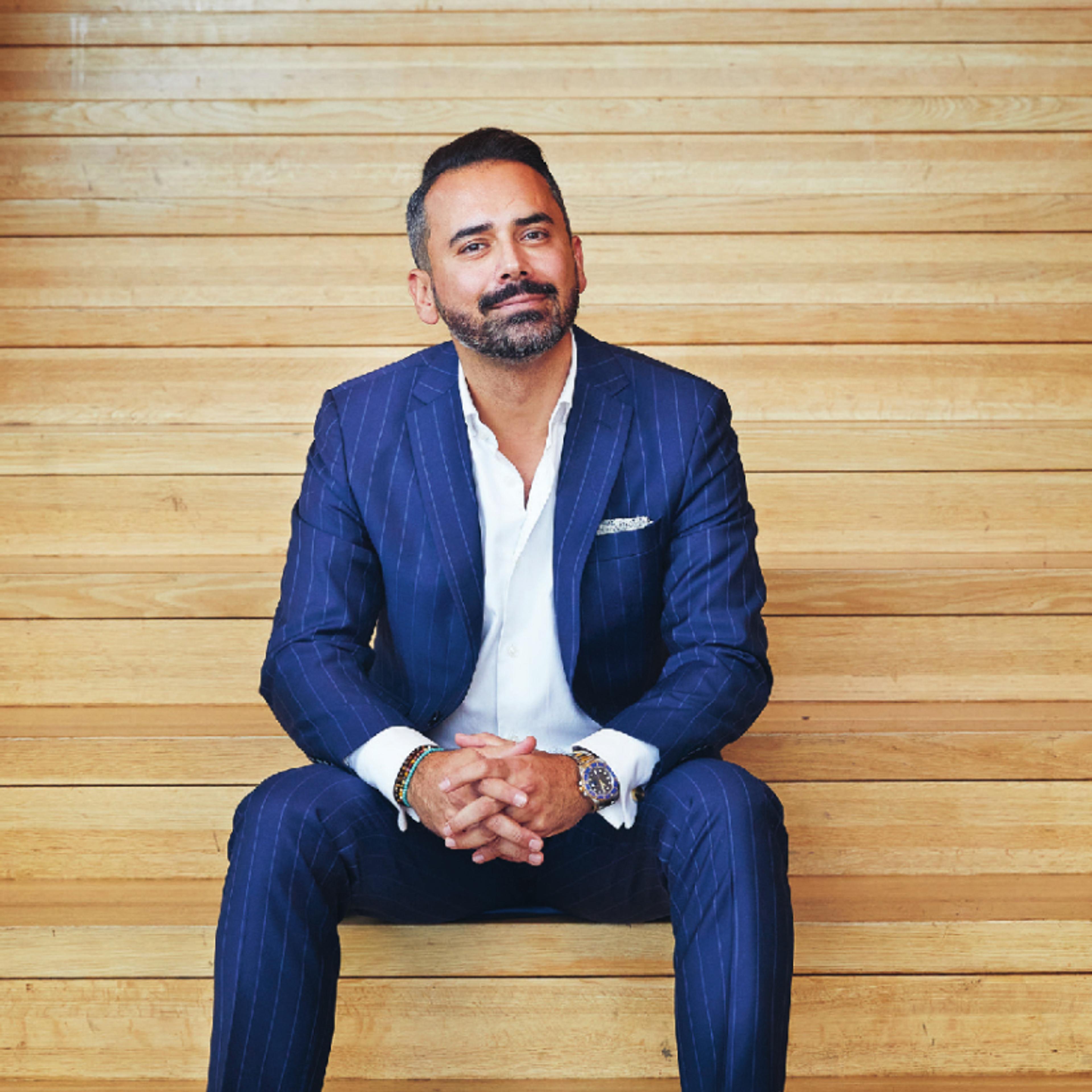 Ali Amini sitting in a stair