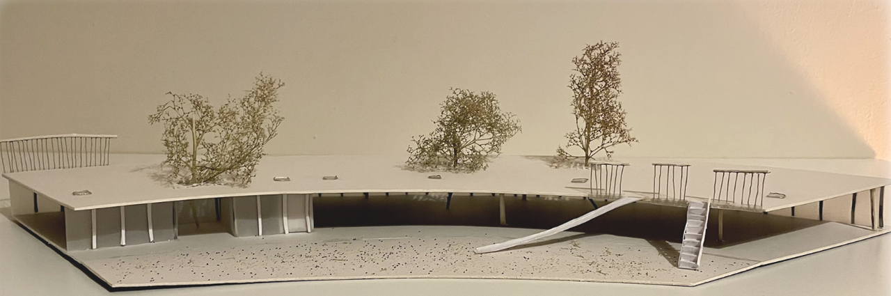 Side view of the card model, showing the thin roof deck, its slender columns and the classrooms underneath.