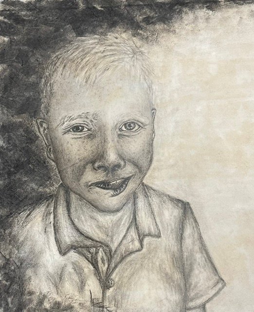 An abstract charcoal and graphite portrait of a split expression, one side is depressed, the other has hope