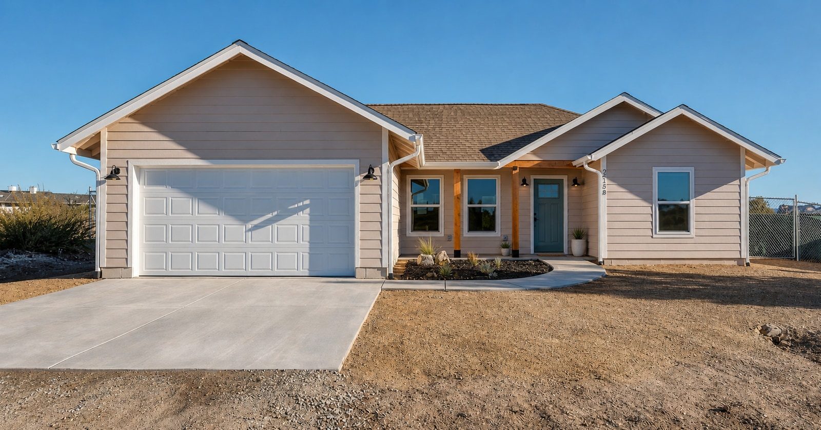 Single-story home exterior with an attached garage and covered entry