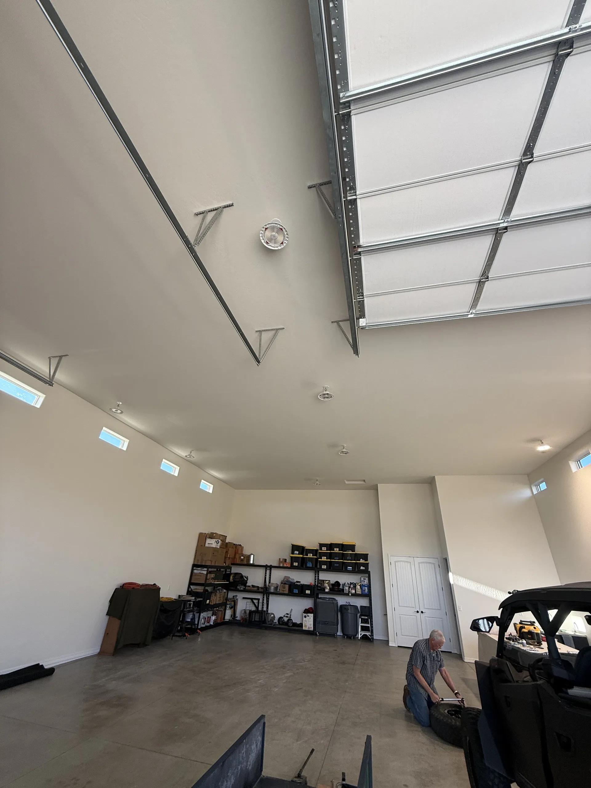 Finished high-clearance interior of the Legend Hills RV garage with storage and workspace