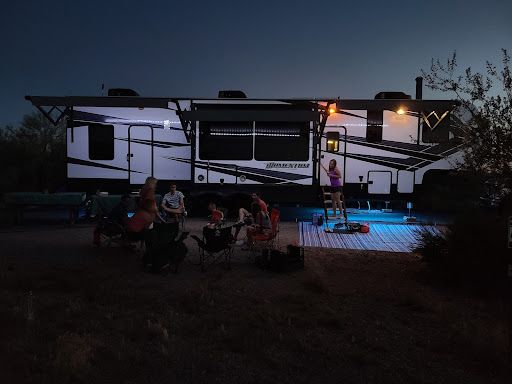 Family camping in fifth-wheel