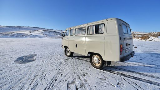 Campervan on Snowy Tundra