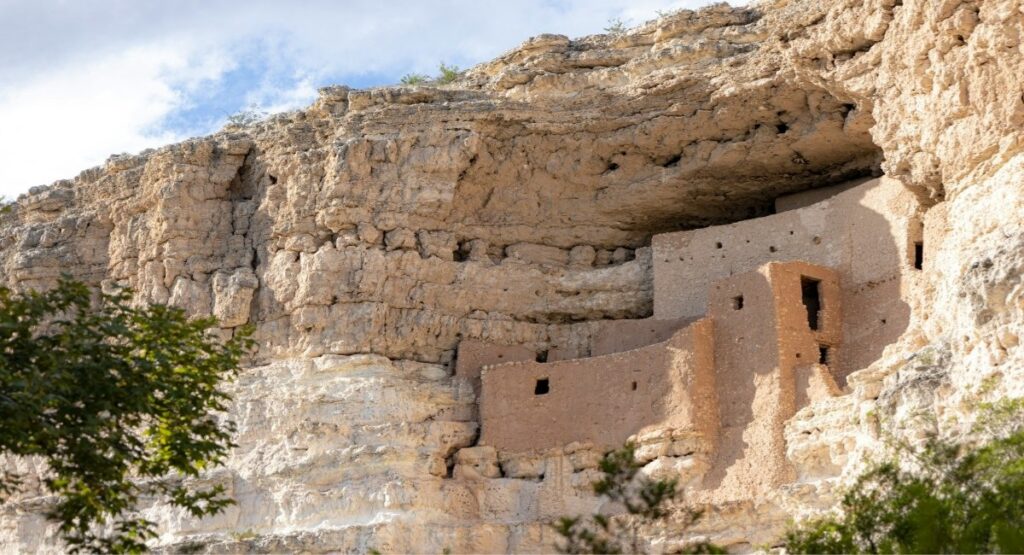 Ancient Sinagua cliff dwellings built into a limestone canyon wall at Montezuma Castle National Monument, Arizona