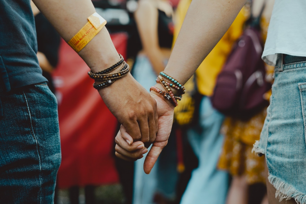 Concertgoers holding hands