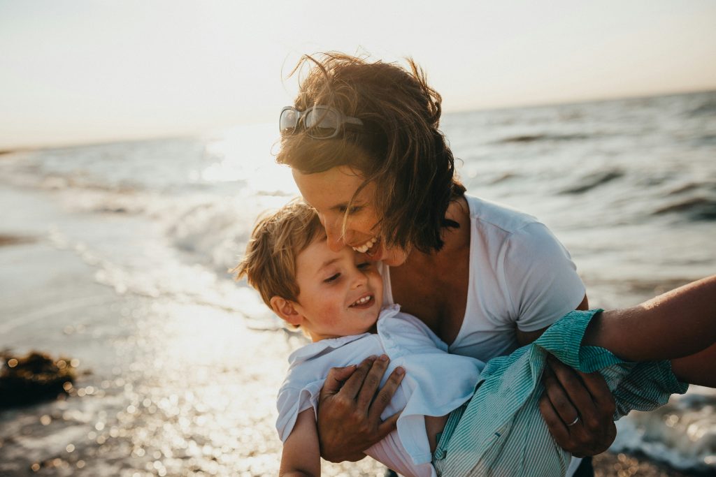 Mother with child at the ocean