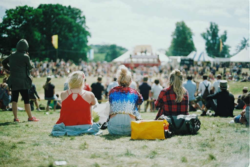 Women sitting at music festival