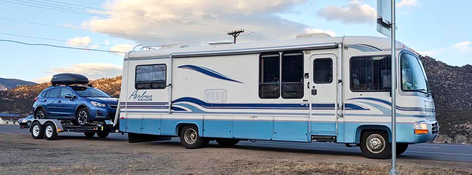 towing car behind rv with car hauler