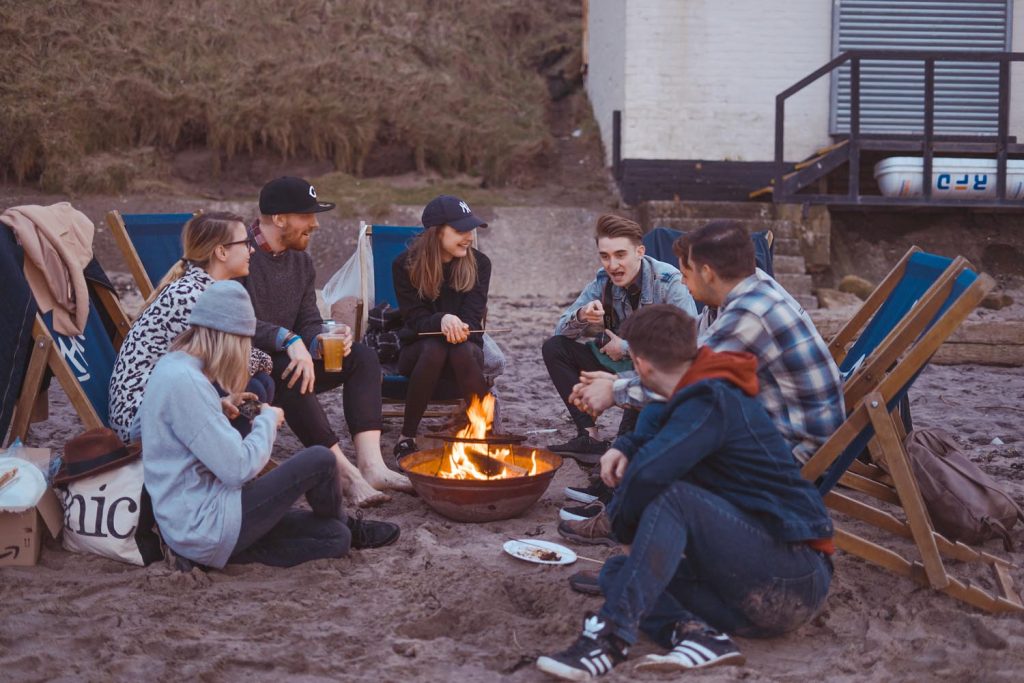 group camping around the campfire