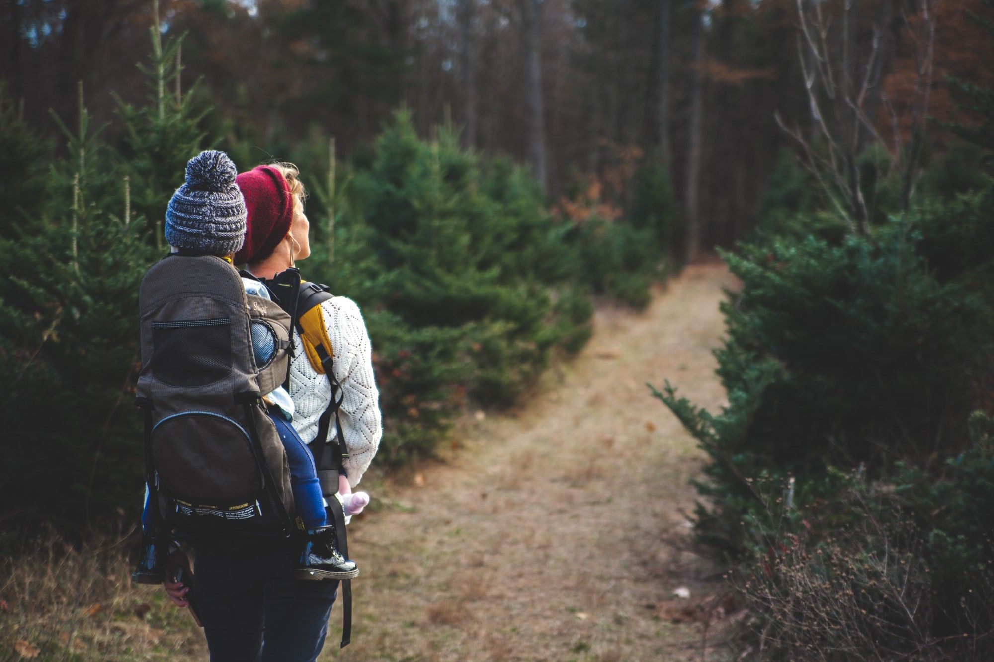 Woman and her child hiking a trail