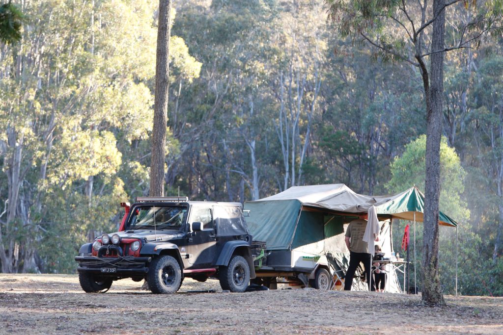 SUV with small travel trailer