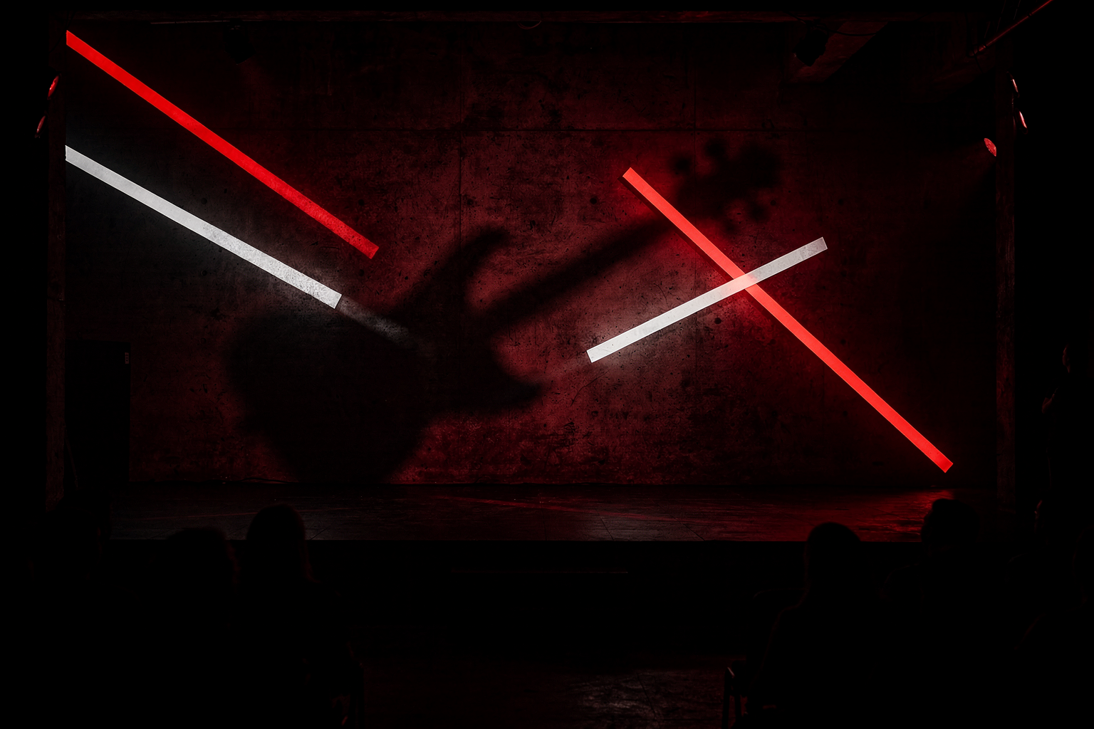 Stark red club lighting and angular guitar shadows for a post-punk guide.