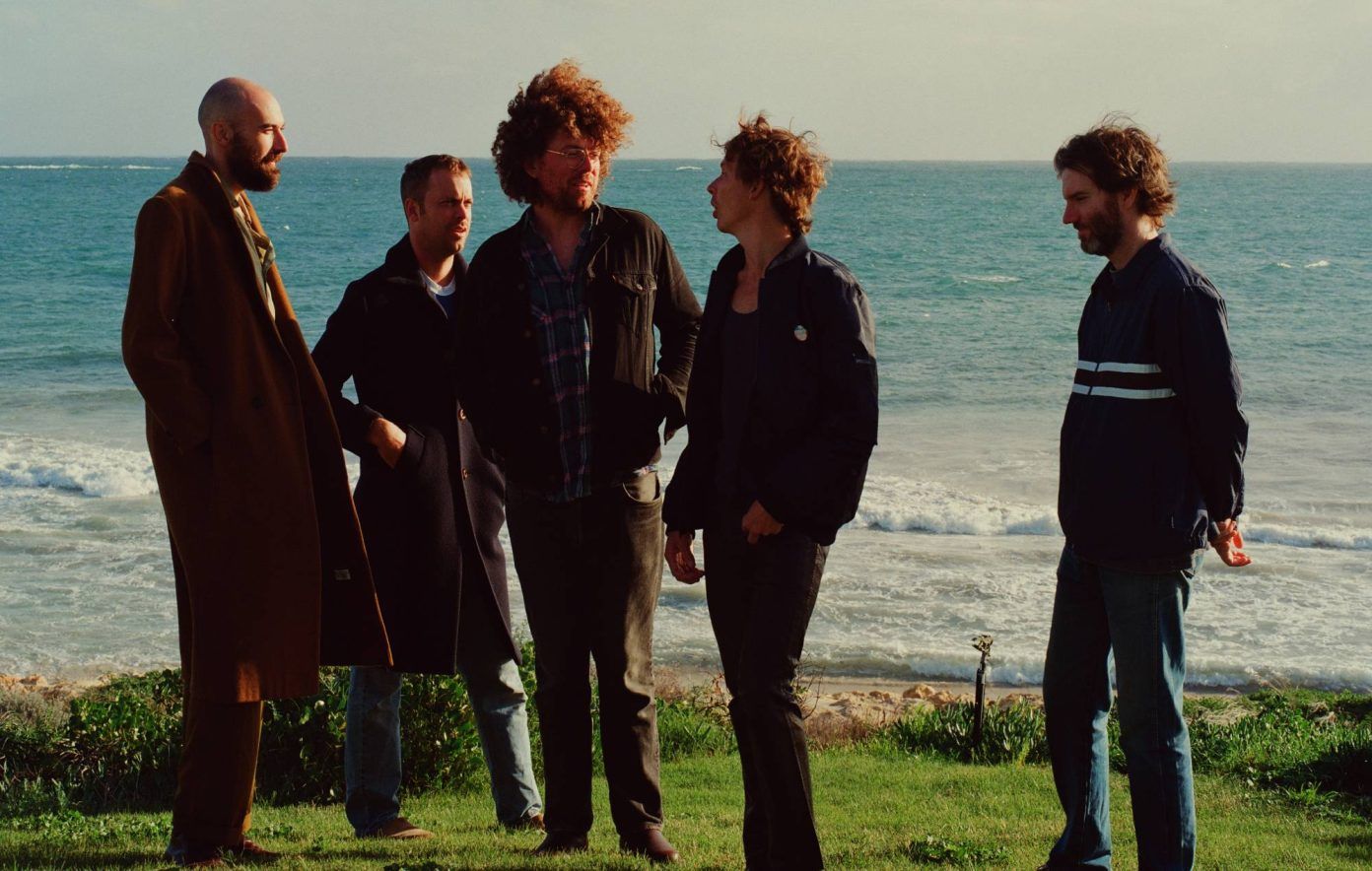Pond stand together outdoors in a sunlit band photo
