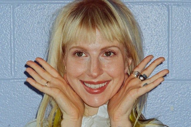 Hayley Williams posing for a promotional tour image