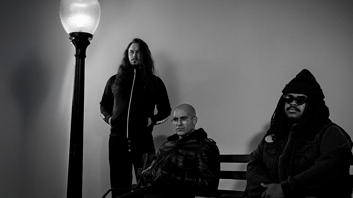 Show Me the Body pose together in a black-and-white band photo