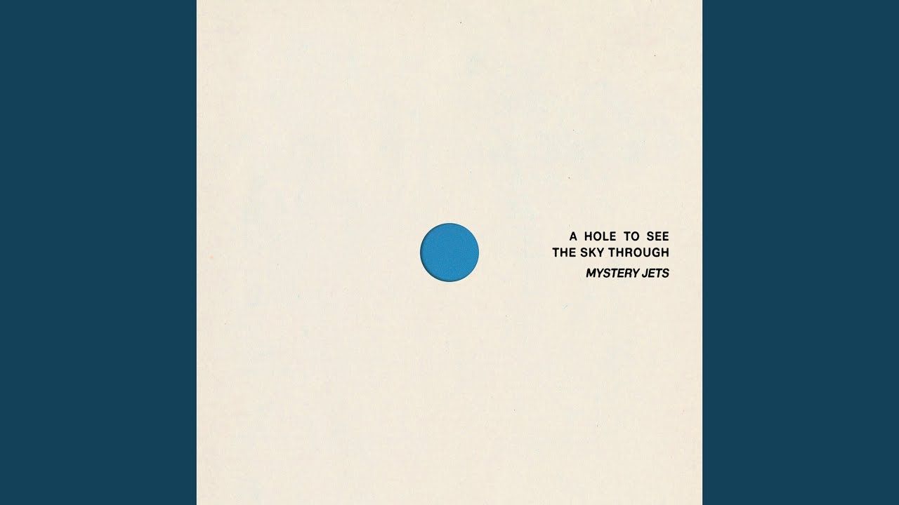 Mystery Jets album artwork with a cream background, blue circle, and small black lettering.