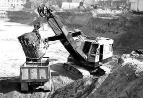 Historic photo of Link-Belt machine dumping material into a truck