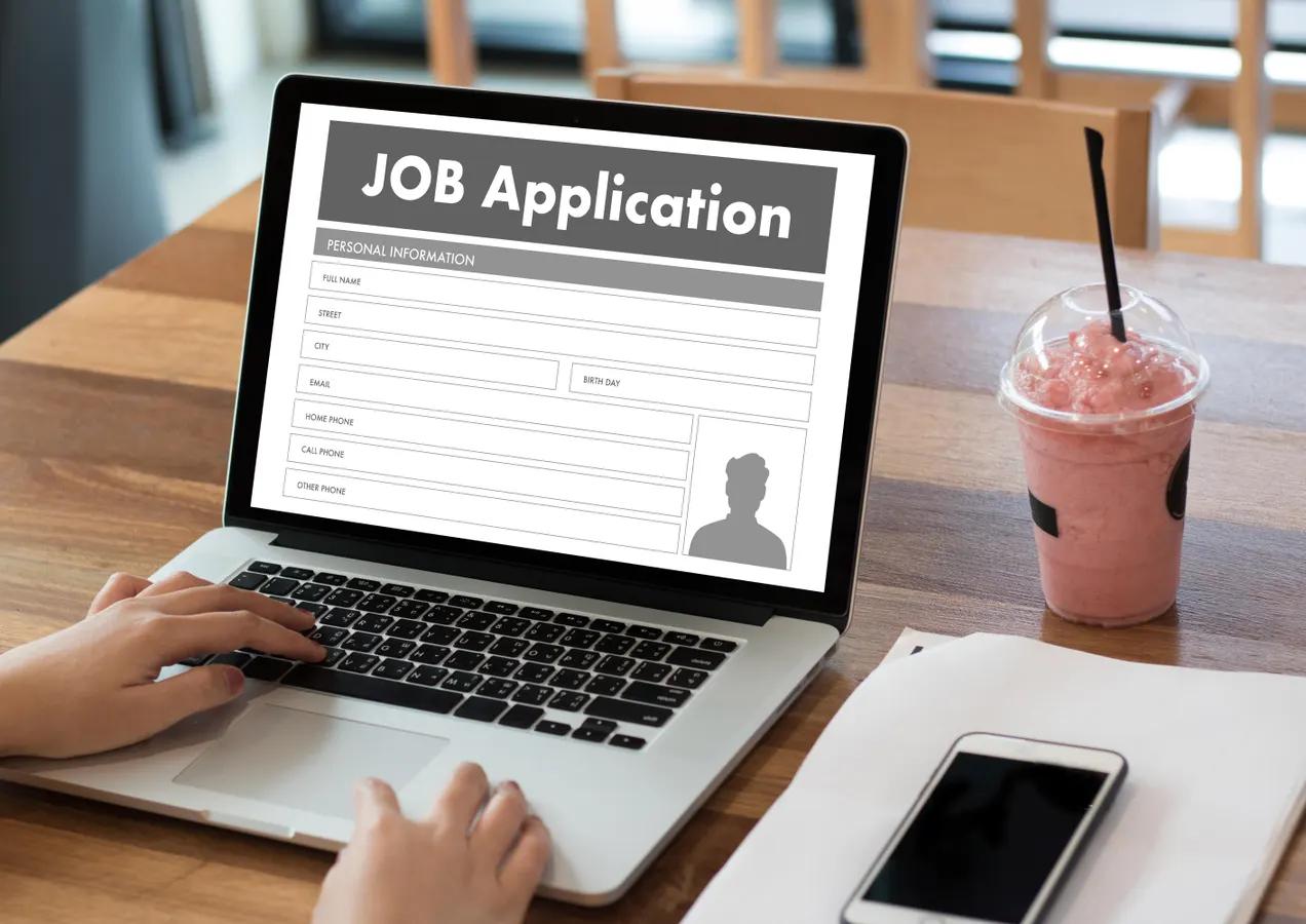 Person applying for US remote jobs on a laptop