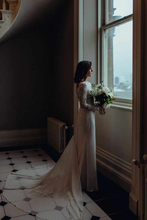 Bride at the window of a historic Dunedin venue