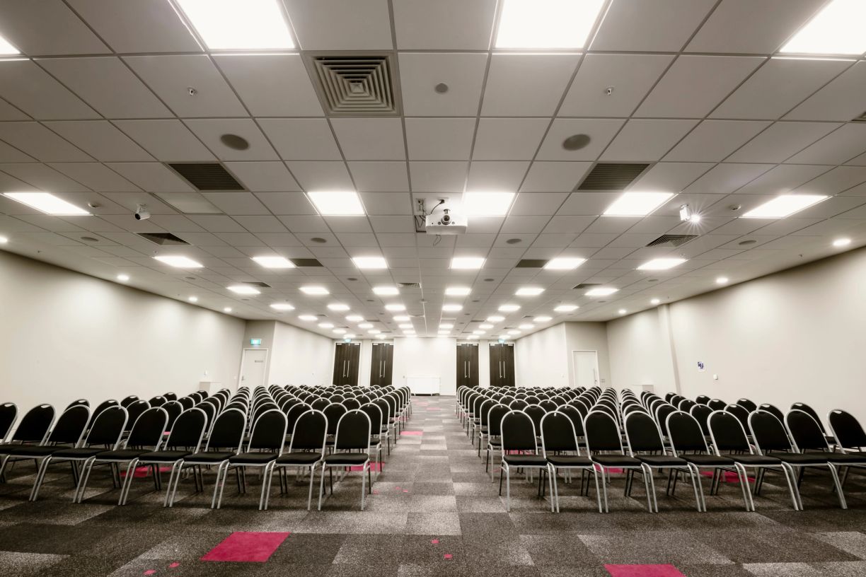 Large space set up with rows of seating