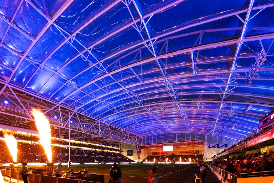 Forsyth Barr Stadium at night with a rugby game