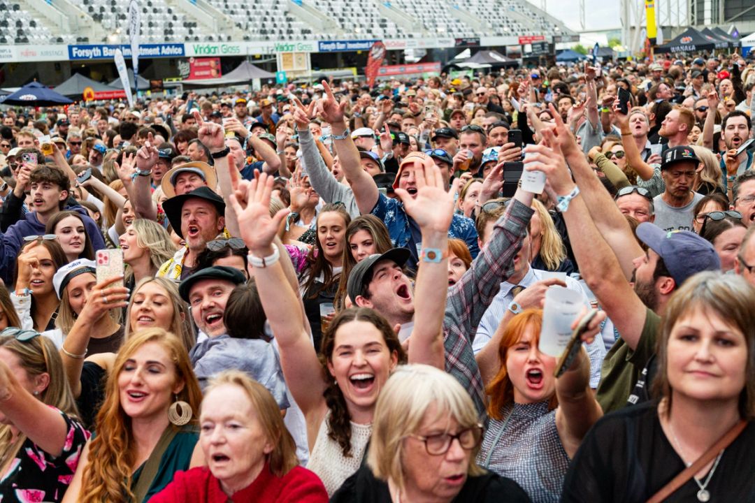 Fans cheering towards the camera