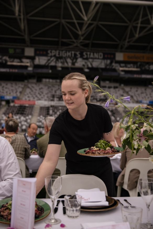 Wait staff serving at an event at Forsyth Barr Stadium