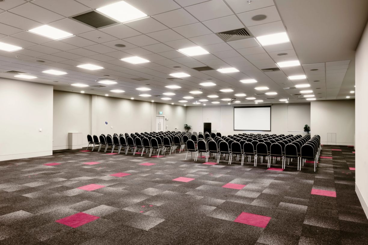 Large space set up with seating and projector screen