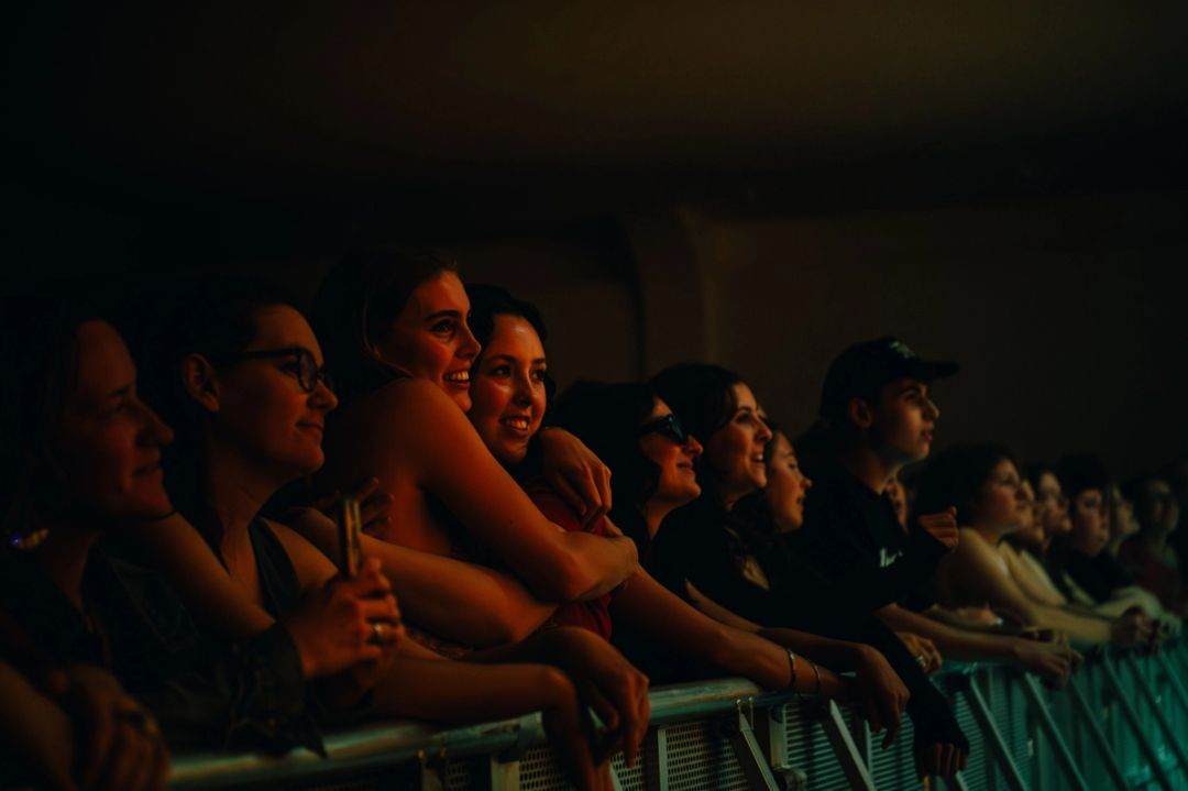 People in the front row of a concert
