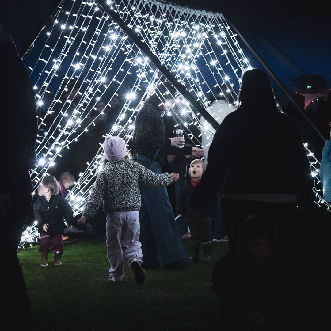 Kids playing with light installation