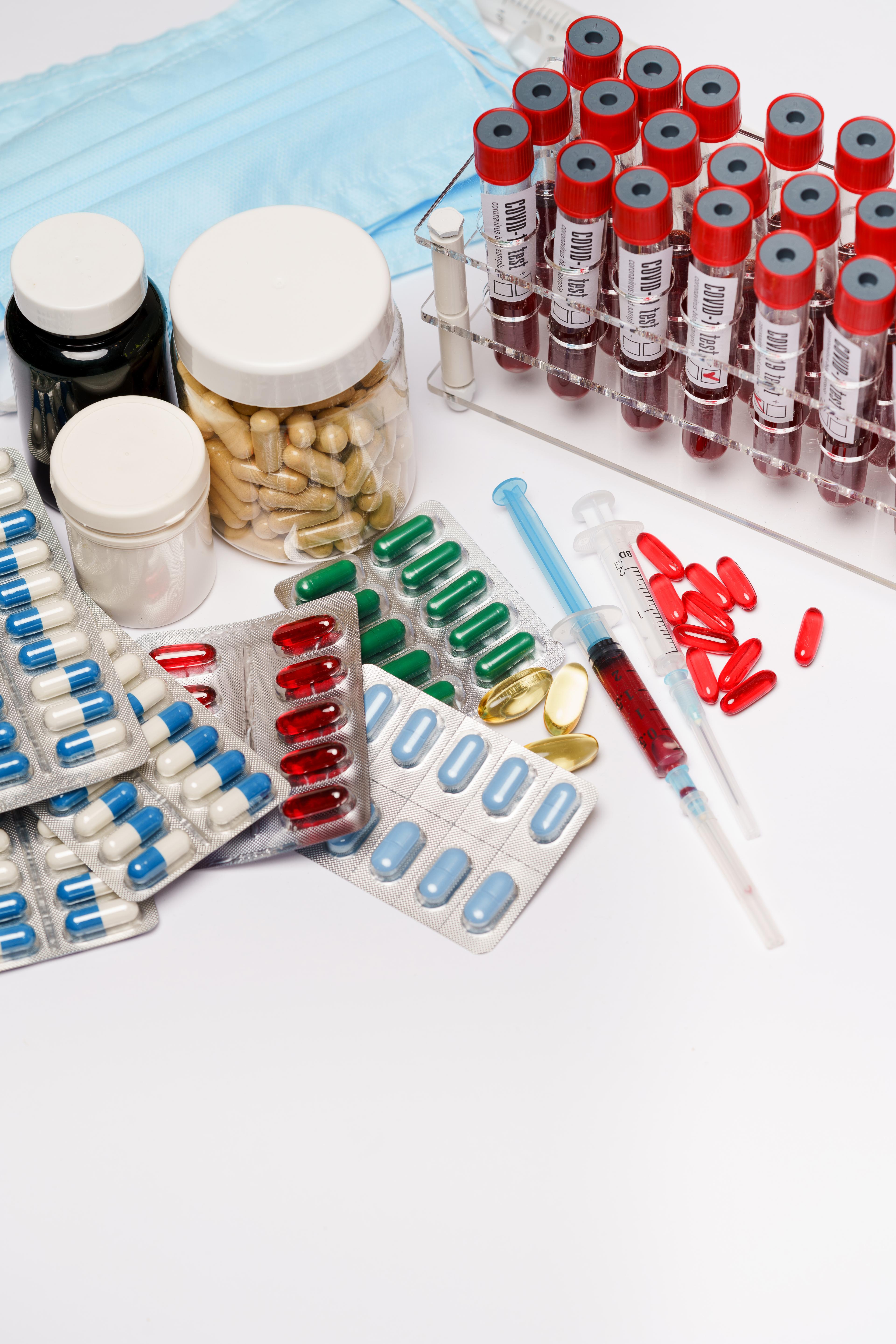 Medicinal pills and syringes