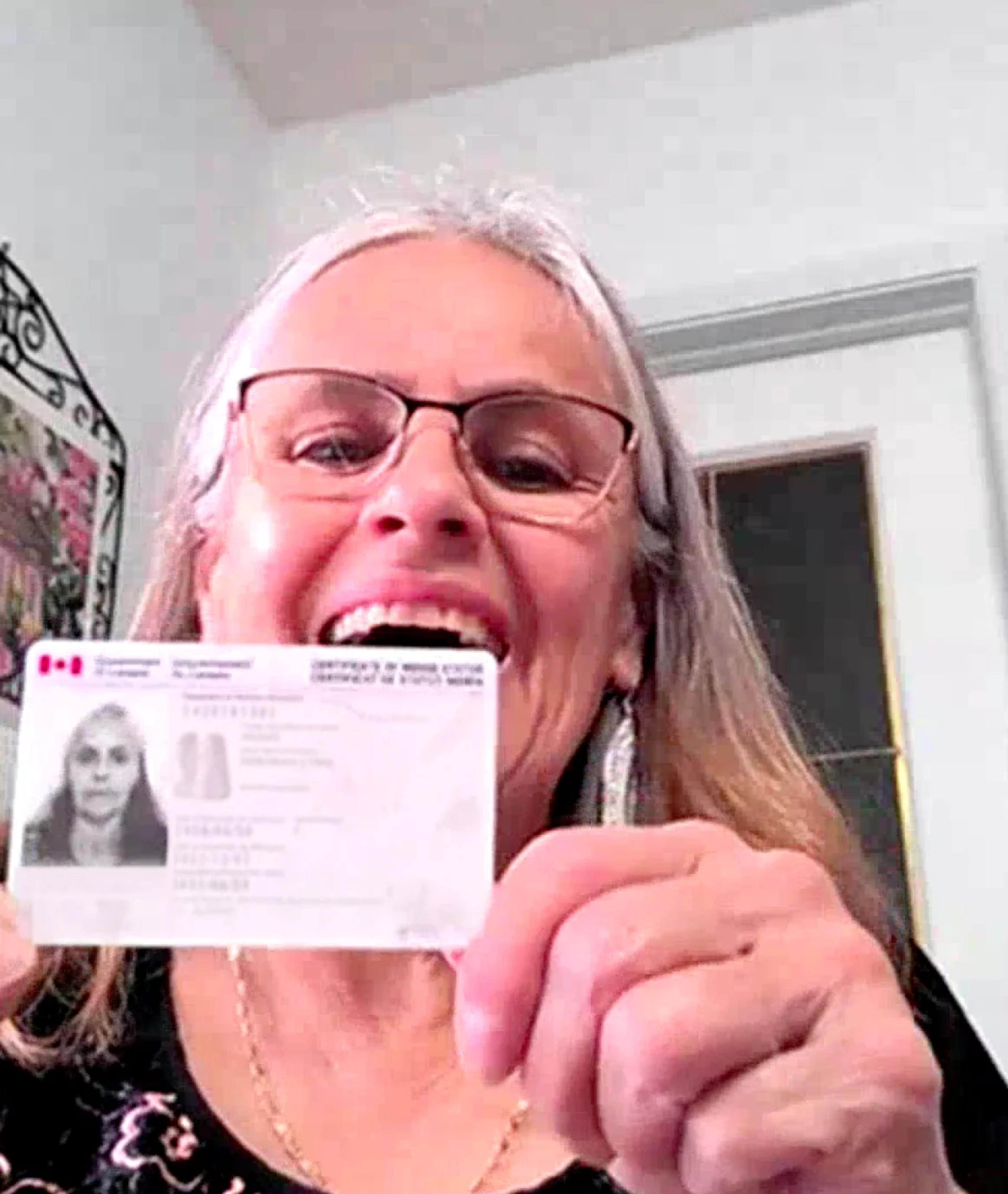 Debbie Moses, Fort Albany Nation receives Status Card with OneFeather