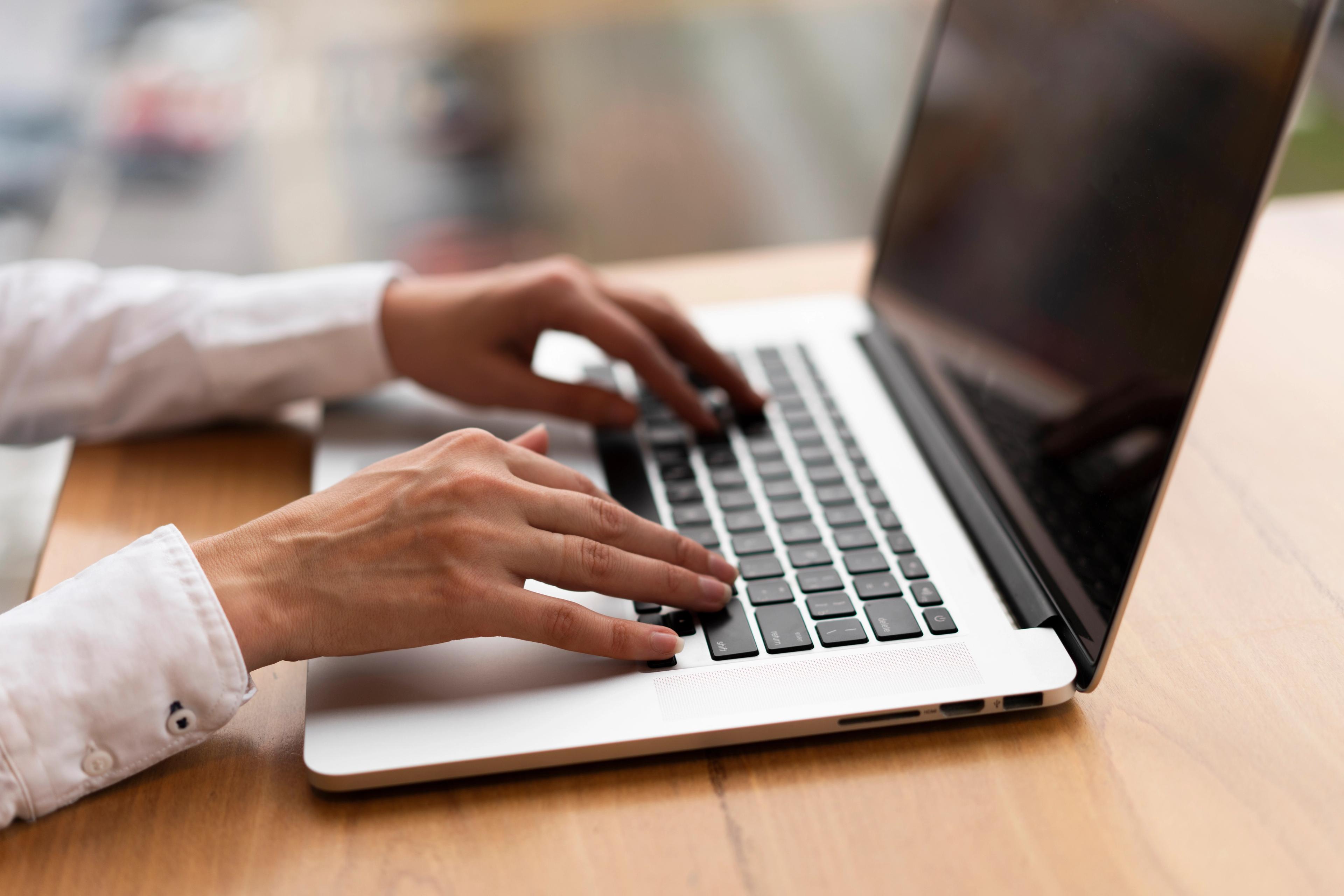 Person typing on a laptop