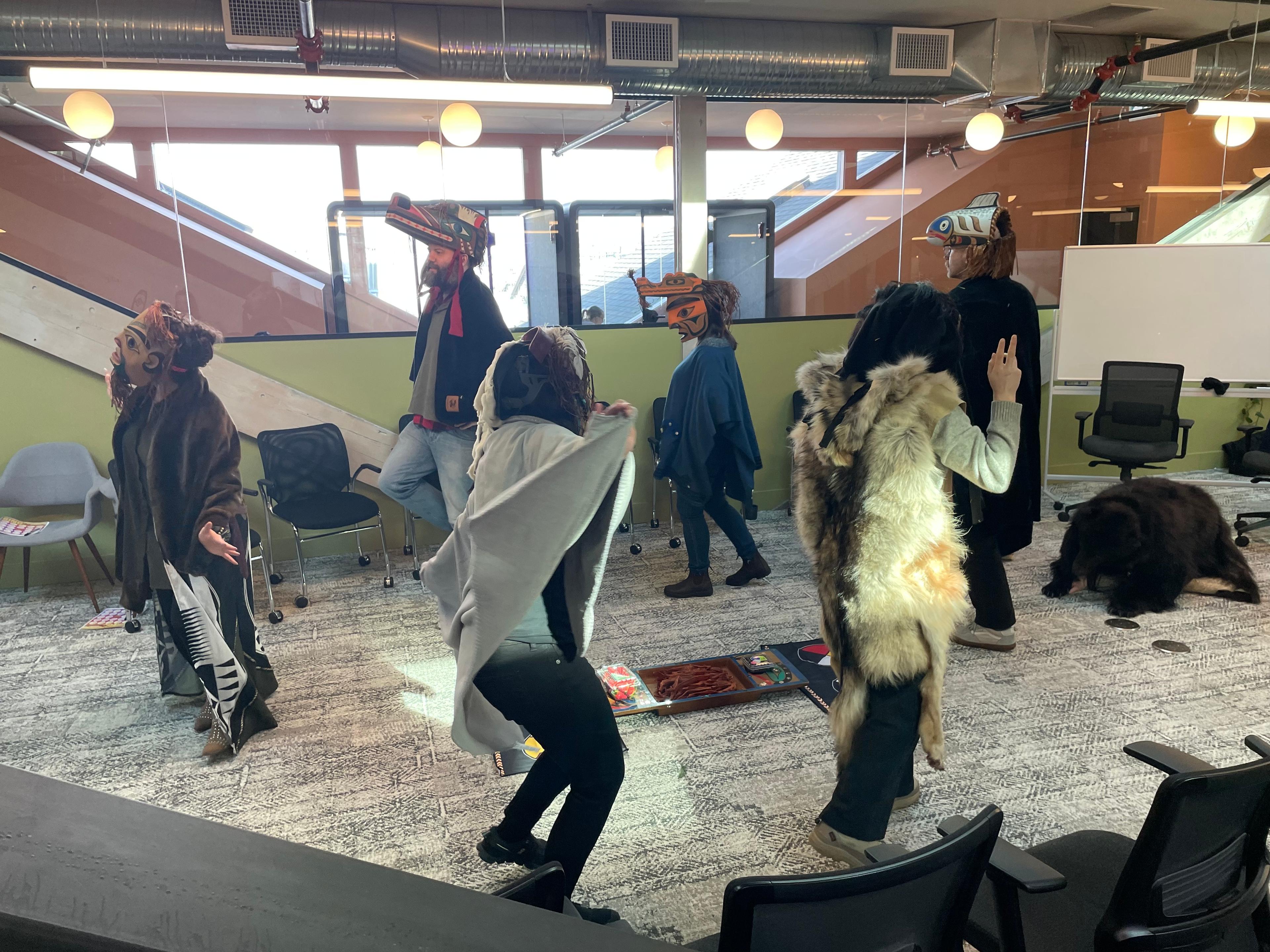 Some members of the OneFeather team in regalia to honour traditional dance