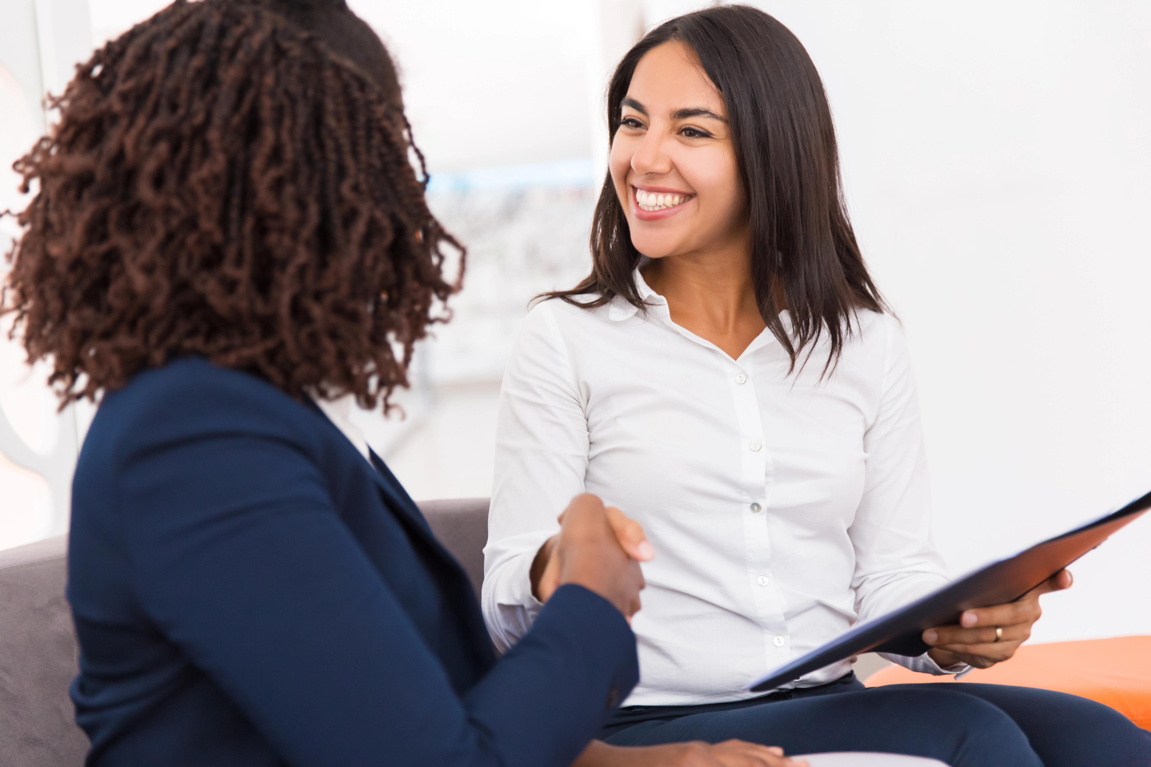 Two businesswomen shaking hands