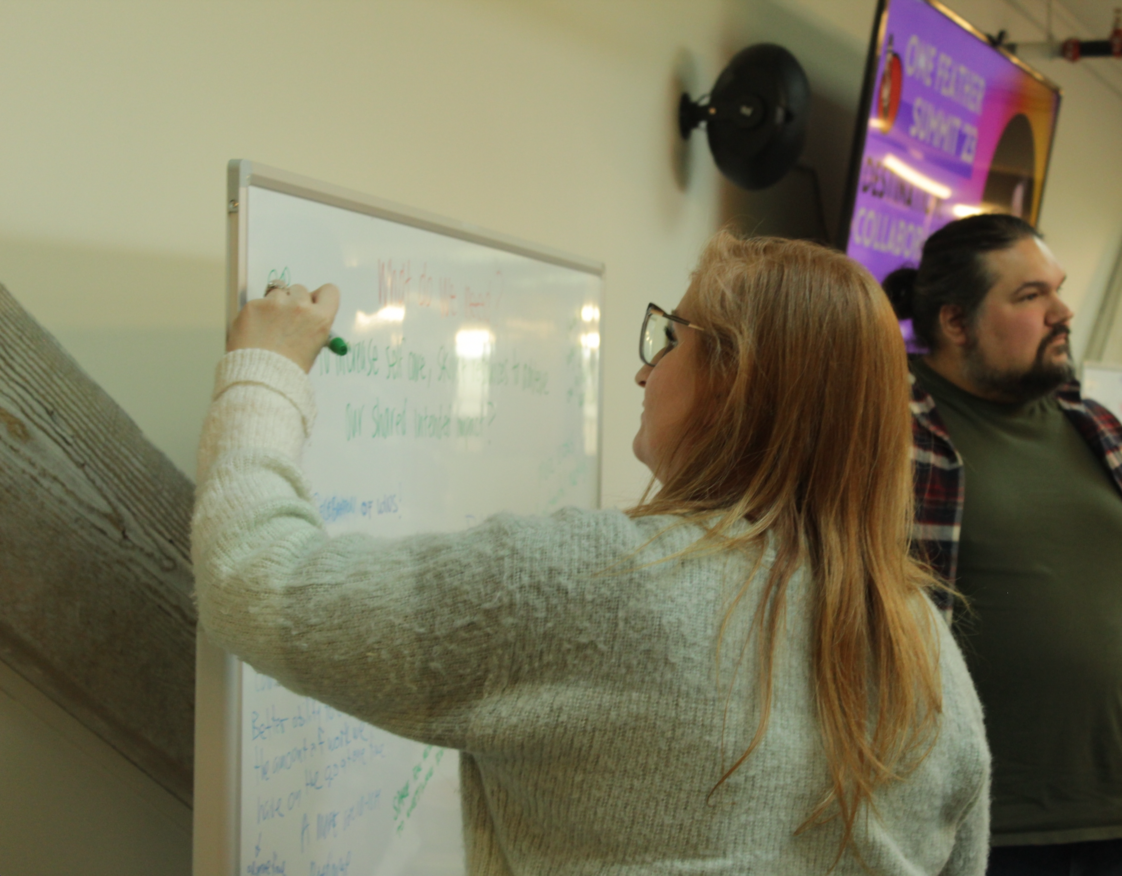 Some OneFeather team members hard at work, and thinking deeply it appears via Ben's pensive face