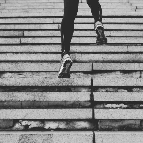 Athlete running up stairs.