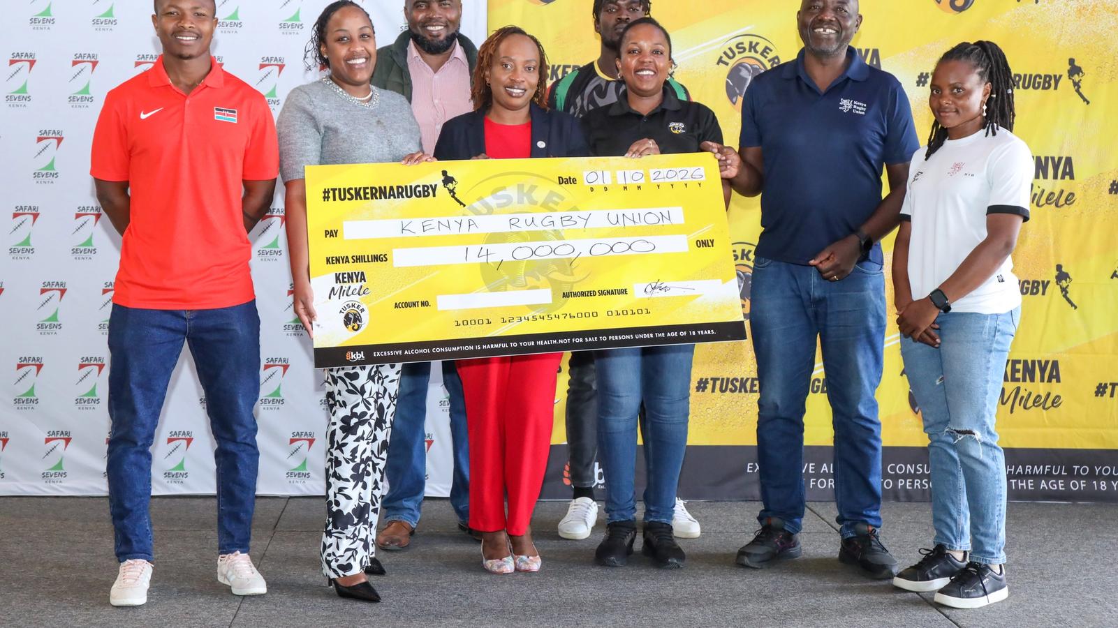Shujaa and Lionesses captain pose for a photo with the KRU board and Tusker